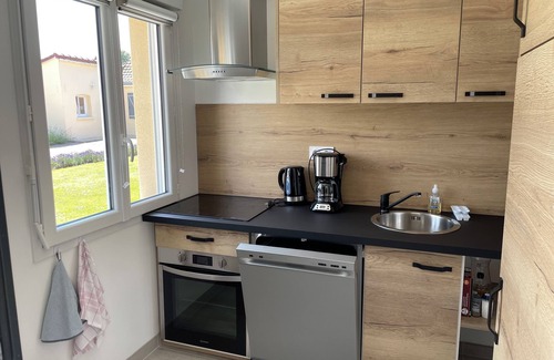 Rue Casa | New home in quiet hamlet close to beaches.