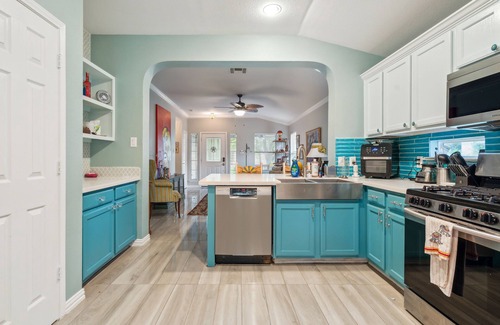 Kyle Casa | NEW LISTING! Eclectic Oasis: Artful & Colorful Comfort by RedAwning