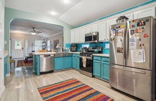 Kyle Casa | NEW LISTING! Eclectic Oasis: Artful & Colorful Comfort by RedAwning