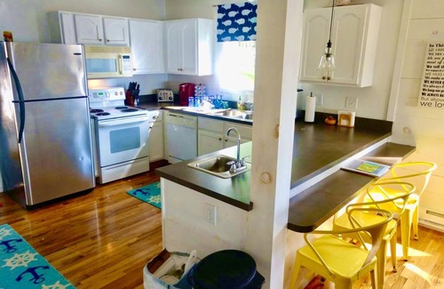 Prudenville Casa | New Listing! Lake front cottage with 100' of private sandy beach