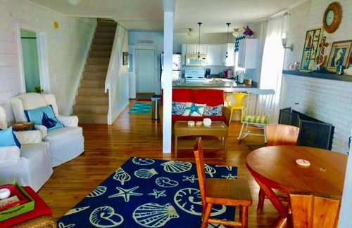 Prudenville Casa | New Listing! Lake front cottage with 100' of private sandy beach