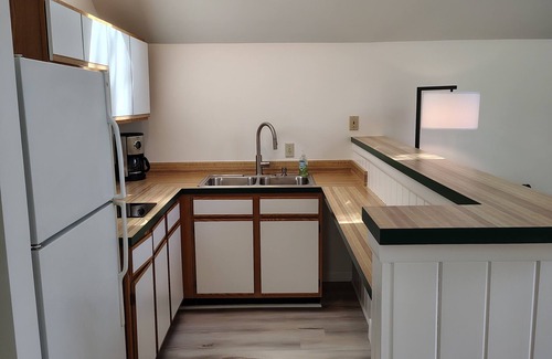 Lake Leelanau Cabaña | NEW! Waterfront Cottage on private Lake Michigan Beach with glorious sunsets