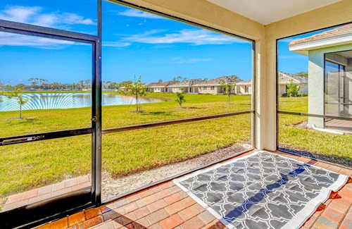 Venice Casa | Newly built, single-story home on a lagoon with a porch, pool and bocce courts