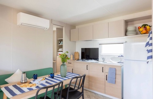Marina di Montalto Casa | Nice and welcoming mobile home located near the beach with air conditioning of approximately 24 m2 composed of a living room, kitchenette with gas stove, fridge with freezer, pots and pans.A bedroom with a double bed and another bedroom with two single b