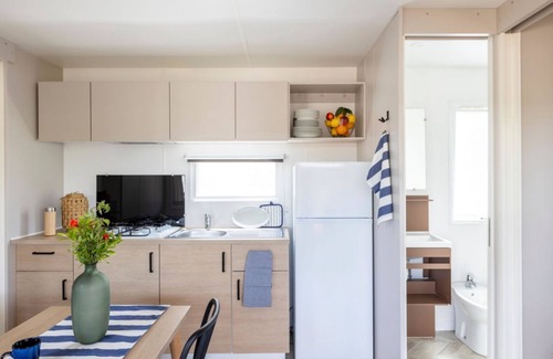 Marina di Montalto Casa | Nice and welcoming mobile home located near the beach with air conditioning of approximately 24 m2 composed of a living room, kitchenette with gas stove, fridge with freezer, pots and pans.A bedroom with a double bed and another bedroom with two single b