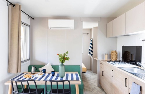 Marina di Montalto Casa | Nice and welcoming mobile home located near the beach with air conditioning of approximately 24 m2 composed of a living room, kitchenette with gas stove, fridge with freezer, pots and pans.A bedroom with a double bed and another bedroom with two single b