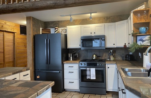 Nadeau Cabina | Majestic Log Home en 400 pies de frente al lago Michigan.