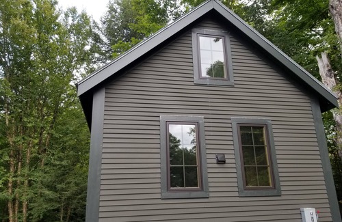 Craftsbury Cabina | Northwoods Guest Cabin and firepit & porch overlooking private woods and stream