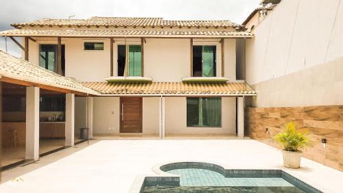 Bom Pastor Casa | NossoApê Guarua: Piscina | Churrasqueira | Ar-condicionado