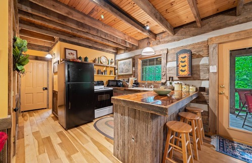 Gnaw Bone Cabina | Nostalgic log cabin antique furnishings nestled in wooded serenity Pet Friendly!