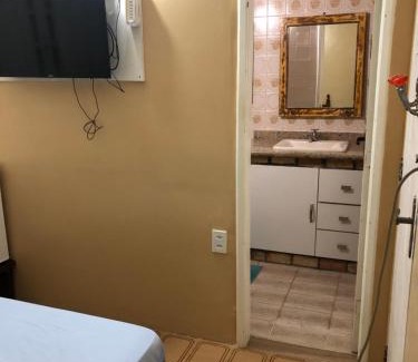 Taio Casa | O Mar Hospedagem - SUÍTES PRIVADAS