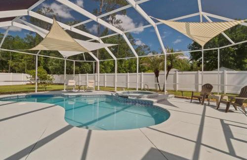 Palm Coast Casa | Oasis Heated Pool Spa Fenced Yard Bicycles