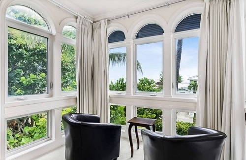 Ocean Ridge Casa | Ocean view estate w/ in ground outdoor pool, breezy terraces, and covered lanai