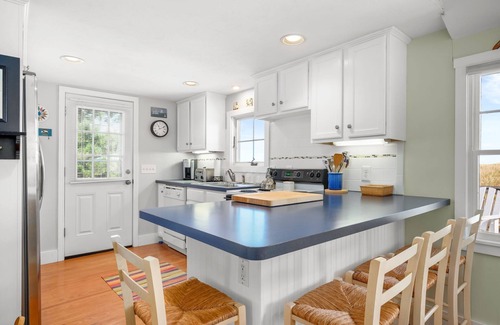 Sagamore Beach Casa | Oceanfront at Sagamore Beach with clean, crisp, Cape Cod interior and coastal furnishings