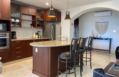 Majahual Apartamento | Oceanfront penthouse with private rooftop, pool and bbq area