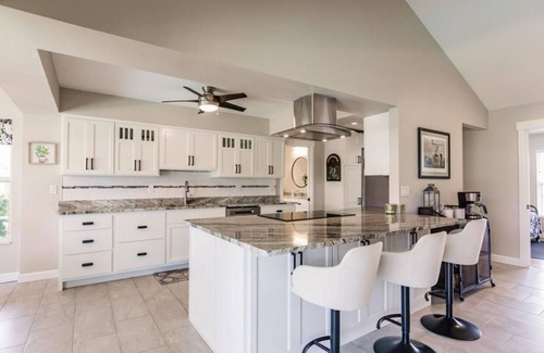 Fort Myers Casa | Offering breathtaking views of the sun setting over the water.