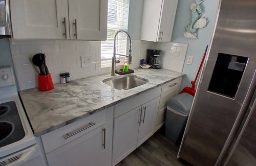 Bonita Shores Cabaña | Old Florida Fishing Cottage See The Water From Living Room on Imperial River
