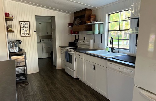 Suwannee Casa | Old Florida Waterfront Getaway - Large Porch, Big Dock, & Pet Friendly