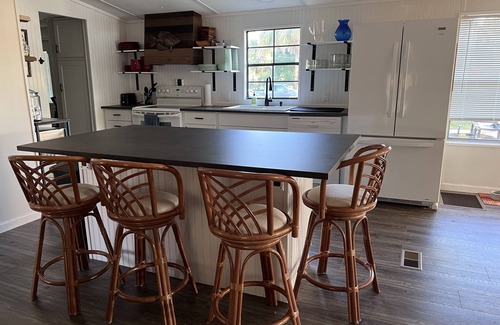 Suwannee Casa | Old Florida Waterfront Getaway - Large Porch, Big Dock, & Pet Friendly