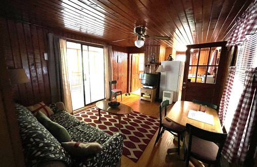 Bat Cave Cabaña | On the River's Edge!! Rocking chairs on large screened porch on river's edge.