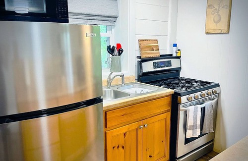 Clayton Casa | Outside Hot Tub. Low Cleaning Fee. Walk to Town. Wi-Fi, Fire Pit, Free Parking.