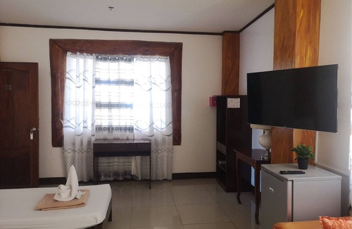 Puerto Princesa City Centre Hotel | OYO 880 Flores De Musa Inn