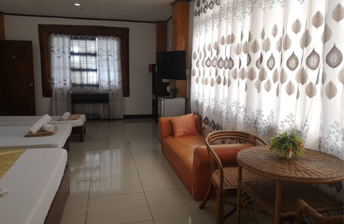 Puerto Princesa City Centre Hotel | OYO 880 Flores De Musa Inn