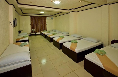 Puerto Princesa City Centre Hotel | OYO 880 Flores De Musa Inn