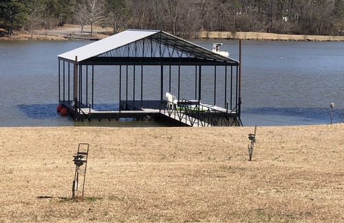 Dawsonville Casa | Panoramic & unobstructed lake views, level walk to shore, & private sandy beach
