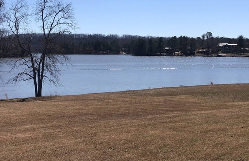 Dawsonville Casa | Panoramic & unobstructed lake views, level walk to shore, & private sandy beach