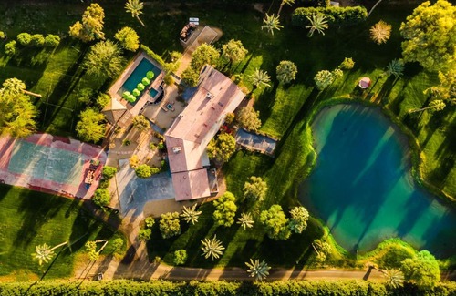 Palm Springs Casa | Paradiso by AvantStay Pool Lake Fire Pit Billiards Room Elegant Secluded Estate