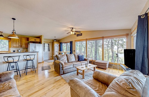 Wisconsin Dells Casa | Peaceful river view home with a furnished deck, firepit, central AC, & WiFi
