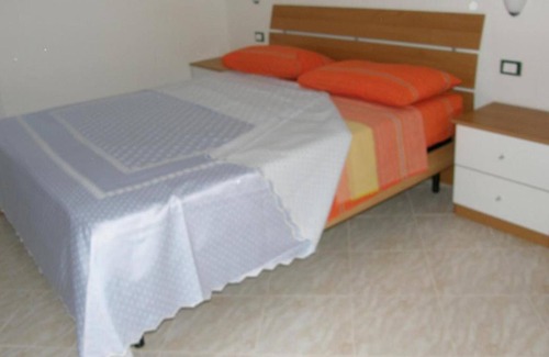 Fluminimaggiore Casa | Apartamento "Residence Pianeta Sardegna 2" con piscina, aire acondicionado y jardín