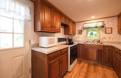 Raymond Cabaña | Pet-friendly waterfront cottage just 26' from the shore of Panther Pond!