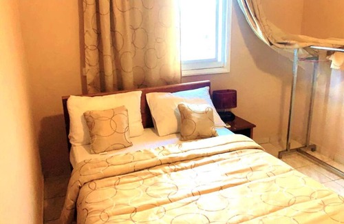 Komo-Mondah Apartamento | Petit appartement cosy avec parking.