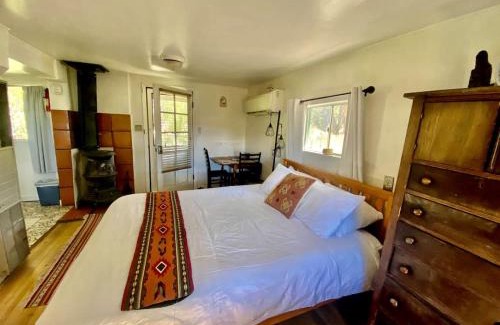 San Cristobal Casa | Petite Log Cabin on Organic Farm in New Mexico