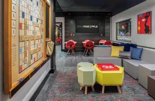 Belltown Hotel | Pineapple Treats & Designer Toiletries in a Vibrant Room near Pike Place Market