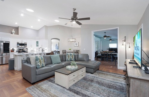 Cypress Lake Casa | Poolside Paradise is a luxurious modern home in the popular community of Parker Lakes