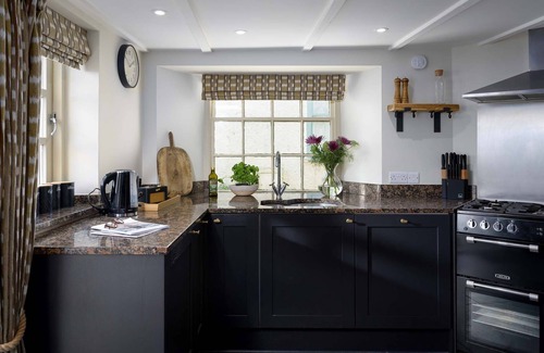 Porth Casa | Porth Beach House is a laid-back coastal pad with front-row views of Porth beach sleeps 10