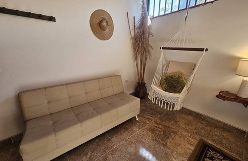 Garzon Cama Y Desayuno | Suite premium - Sala de estar y zona exclusiva en el balcón