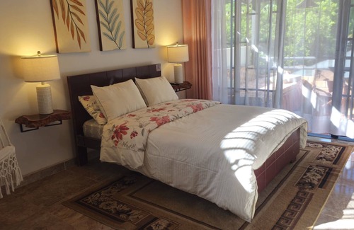 Garzon Cama Y Desayuno | Suite premium - Sala de estar y zona exclusiva en el balcón