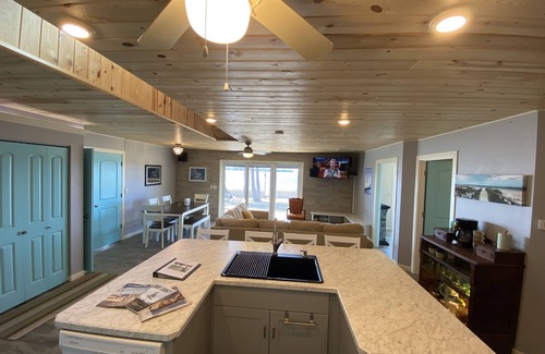 Little Sturgeon Casa | Prime sunsets, great kayaking, huge yard, volleyball court, and free firewood