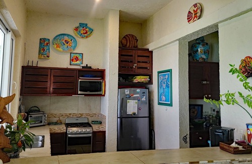 Akumal Condominio | LUJOSO PISO EN PLANTA BAJA FRENTE A LA PLAYA c / PISCINA, VISTAS, PRIVACIDAD Y VALOR!