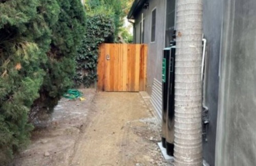 Sunset Park Casa | Private guesthouse with gated pathway entrance and private yard.