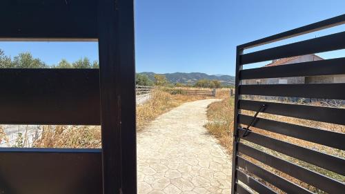 Amphipolis Otro | Private Parking for Cars, Vans, Campers, Bus, RV, Trailer & Caravan with Easy Access to Expressway & Main Road - Quiet Location with Mountain Views, Near the Beach, with 2 Lose Guard Dogs, No Water or Electric, No Shower or Toilet - Self Check-in