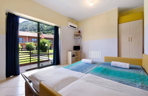 Dervio Complejo | Propiedad en un pueblo de vacaciones 'Studio Lake Como' con jardín compartido y Wi-Fi