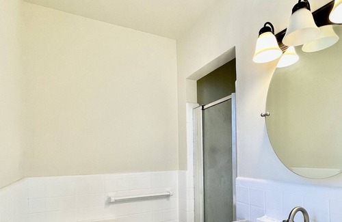 Midtown Cabaña | Quaint cottage style home with two sitting areas-2 minutes to shops and eateries