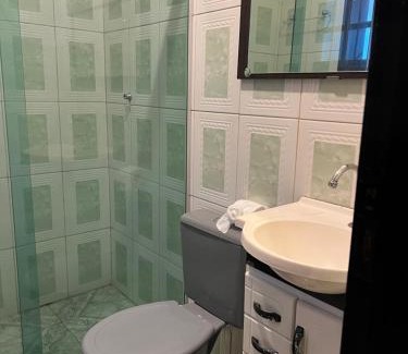 Jardim Primavera Casa | Quarto suite em Caraguatatuba