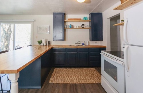 Gold Hill Cabaña | R&R on the Rogue River! This 2 BR cottage in Gold Hill features a private hot tub with stunning scenic views. Enjoy a spacious, private setting perfect for relaxation, adventure, or remote work
