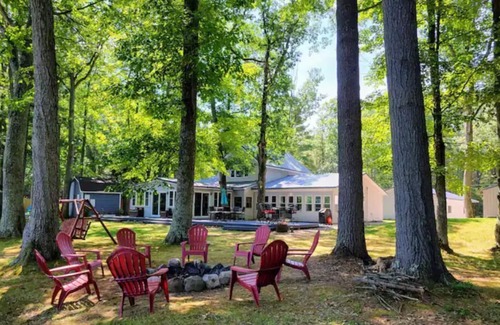 Rapid City Cabaña | Rapid River Retreat riverfront close to Torch Lake